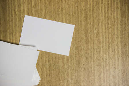 White papers on a wooden table.の写真素材