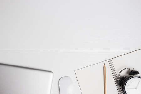 Working items with computer, notebook and a white table.の写真素材