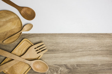 Wooden utensil over the white and wooden table.の写真素材