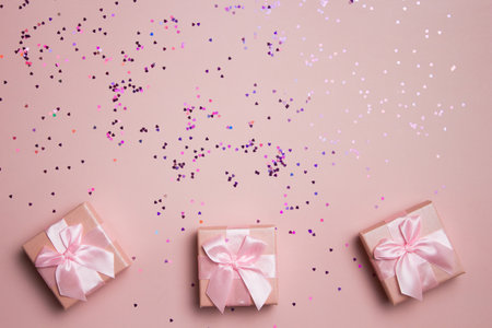 Gift boxes with red heart over the pink background and copy space.の写真素材