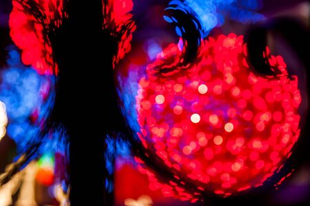 Blury white lights_red bright balls behindの写真素材