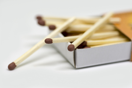 A close-up of wooden matches in a boxの写真素材