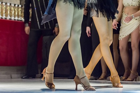 female legs of young girls who dance in competitionの写真素材