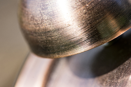 macro shot of a bell of an old watchの写真素材