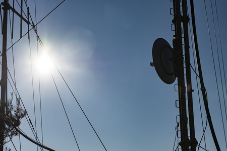 Communication towers, antennas and dishes over the mountainの写真素材
