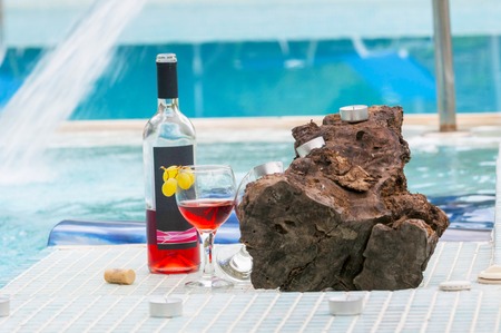 bottle of rose wine in poolsideの写真素材