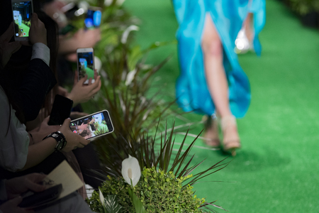 legs of a model catwalk in fashion showの写真素材