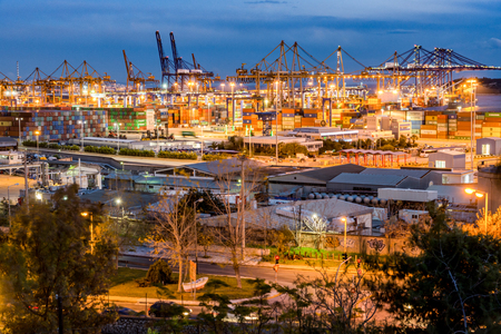 Trading Port Activity,trucks,vehicles, Hoisting Cranes at eveningのeditorial素材