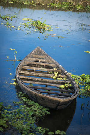 Drowning cockle boat in a dying canal.の写真素材