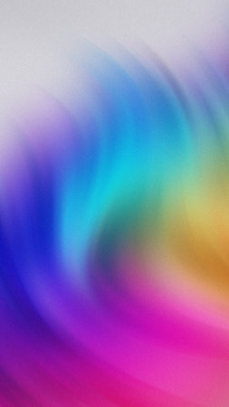 Swirling rainbow gradient with soft textured effect in purple blue cyan green yellow pink orangeの写真素材