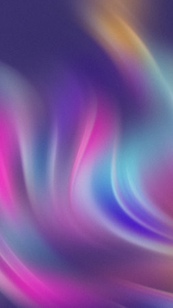 Swirling abstract light trails in vibrant pink, blue, purple, and yellow hues create a soft, luminous gradient background.の写真素材