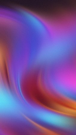 Abstract swirling gradient of purple blue pink red and orange with a subtle grain textureの写真素材