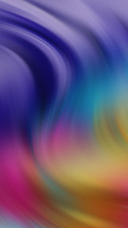 Swirling abstract gradient of purple blue pink yellow and orange colors with a soft texture.の写真素材