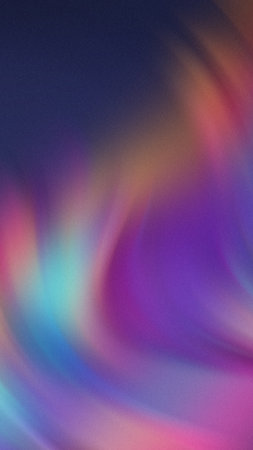 Abstract swirling gradient of purple blue pink and orange with subtle grain textureの写真素材