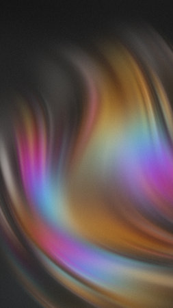 Abstract swirling iridescent colors with a dark textured background.の写真素材
