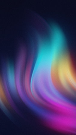 Abstract swirling light streaks in vibrant blues purples pinks and yellows against a dark backgroundの写真素材