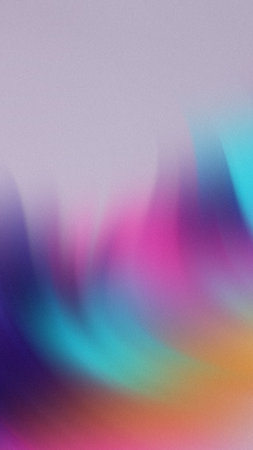 Softly blended gradient of purple pink blue teal and orange with a subtle grainy textureの写真素材