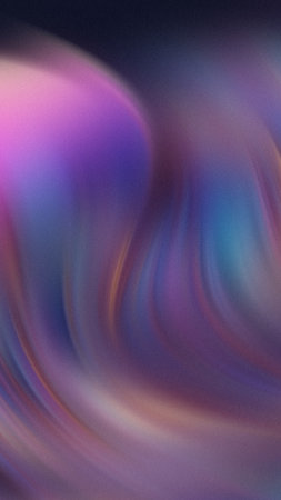 Abstract swirling colors of purple pink blue and gold create a soft ethereal flow.の写真素材