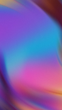 Smooth gradient blend of purple blue pink and orange with subtle grain textureの写真素材