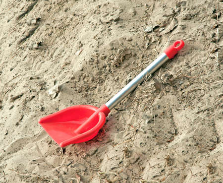 Toy shovel in sandの写真素材