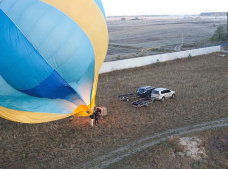 Blown balloon at start and carsの写真素材
