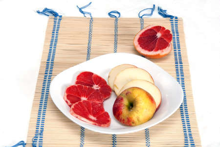 fruits on white dishの写真素材