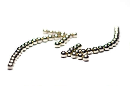 Macro arrows from metal ballsの写真素材