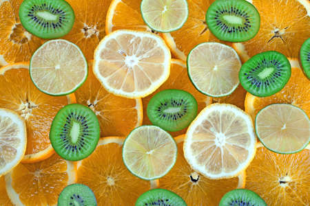Kiwi, lime, lemon, orange slices backgroundの写真素材