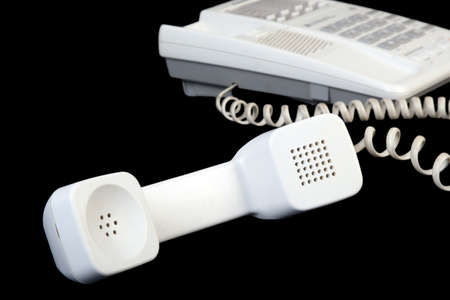 White handset isolated on black 