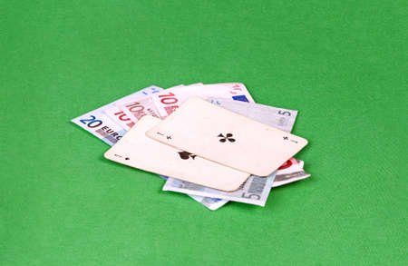 Two aces with euros on green gambling tableの写真素材