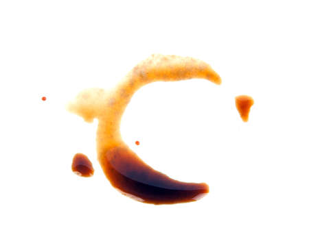 Spot from bottle of soy sauce isolated on whiteの写真素材
