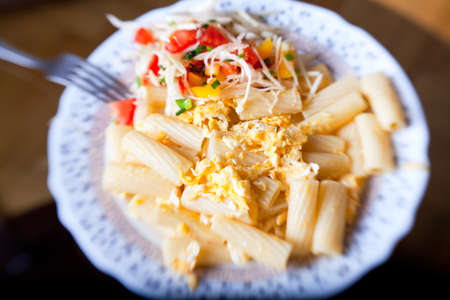 Pasta with salad from tomato and cabbage, selective focusの写真素材