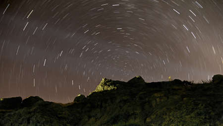 Night sky with star tracks in the mountains
