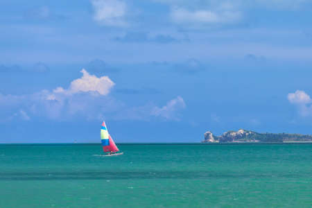 Yacht sailing in the sea in sunny dayの写真素材