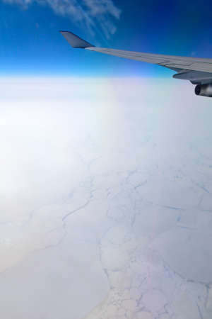 Frozen ocean, aerial view from illuminator of flying aircraftの写真素材