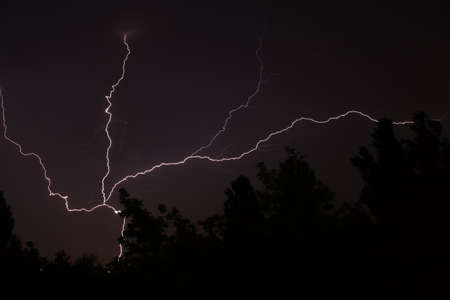 White lightning during summer storm at night