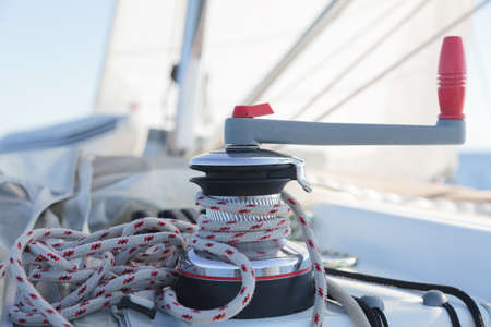 Winch with rope on sailing boat in the seaの写真素材