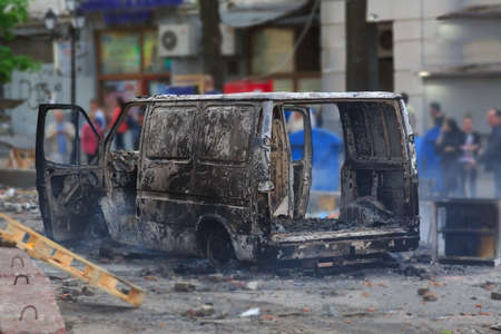 Burned car in the center of city after unrest in Odesa, Ukraineの写真素材
