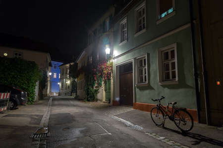 Bicycle on the night european city street in Germanyの写真素材