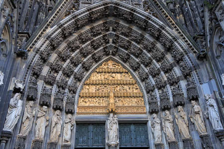 Statues of the saints above the entrance of Cologne cathedral, Germanyの写真素材