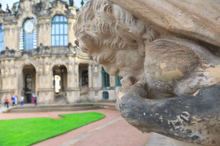 Closeup half naked faunus statue playing panpipe at Zwinger palace in Dresden, Germanyのeditorial素材