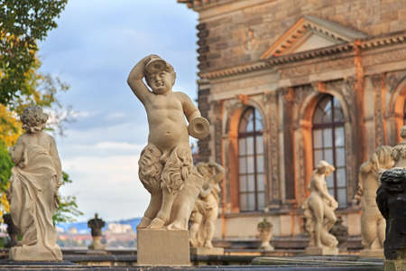 Closeup stone statue of child faunus at Zwinger palace in Dresden, Germanyのeditorial素材