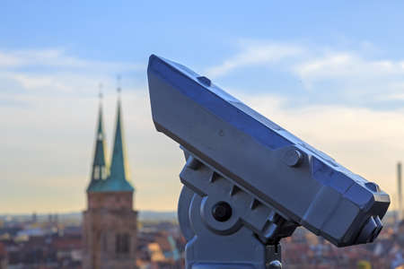 Telescope in the Nuremberg castle, view of the city, church, sky, cloudsのeditorial素材
