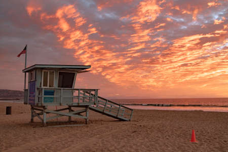 Lifeguard station with american flag on Hermosa beach at sunset, California, USAの写真素材