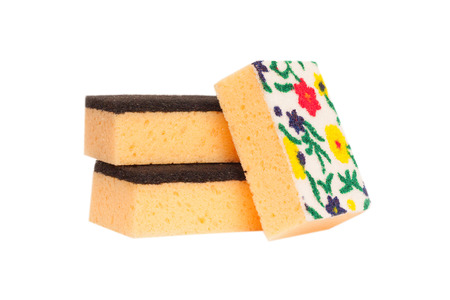 Kitchen sponge for washing dishes. Isolated on white backgroundの写真素材