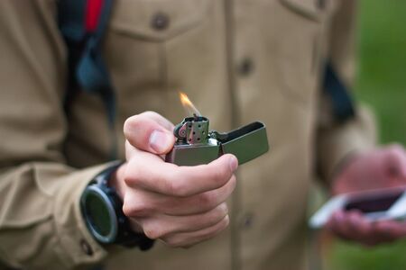 Tourist using lighter in the tourの写真素材