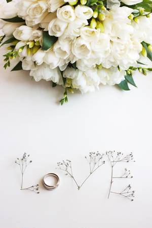 The word "Love" made up of flowers on a white background. Bouquet of flowersの写真素材