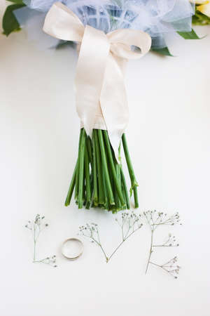 The word "Love" made up of flowers on a white background. Bouquet of flowers.の写真素材