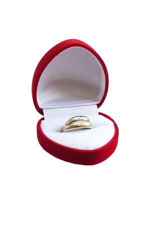 Gold wedding rings in a red box. Isolated on white backgroundの写真素材