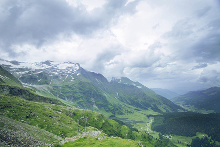 Waterfall and glacier in Hohe Tauern national park, Austria. View of the Hocharn.の写真素材